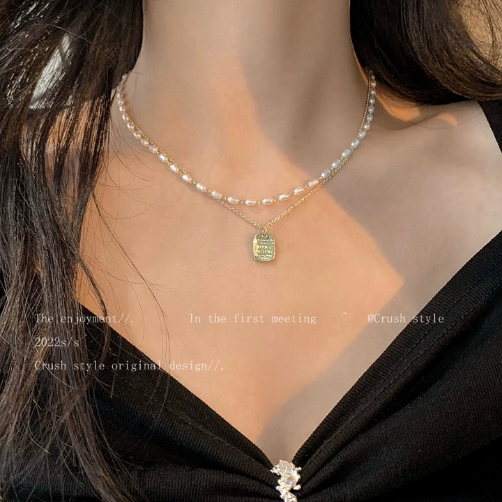 Gold pearl necklace women's spring sense of luxury, light luxury, niche necklace accessories, double layered personality clavicle chain
