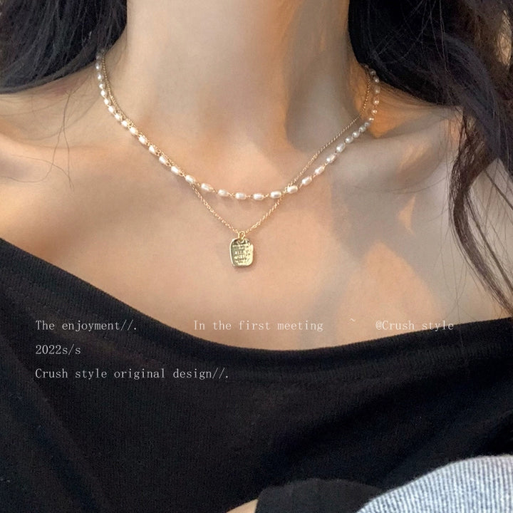 Gold pearl necklace women's spring sense of luxury, light luxury, niche necklace accessories, double layered personality clavicle chain
