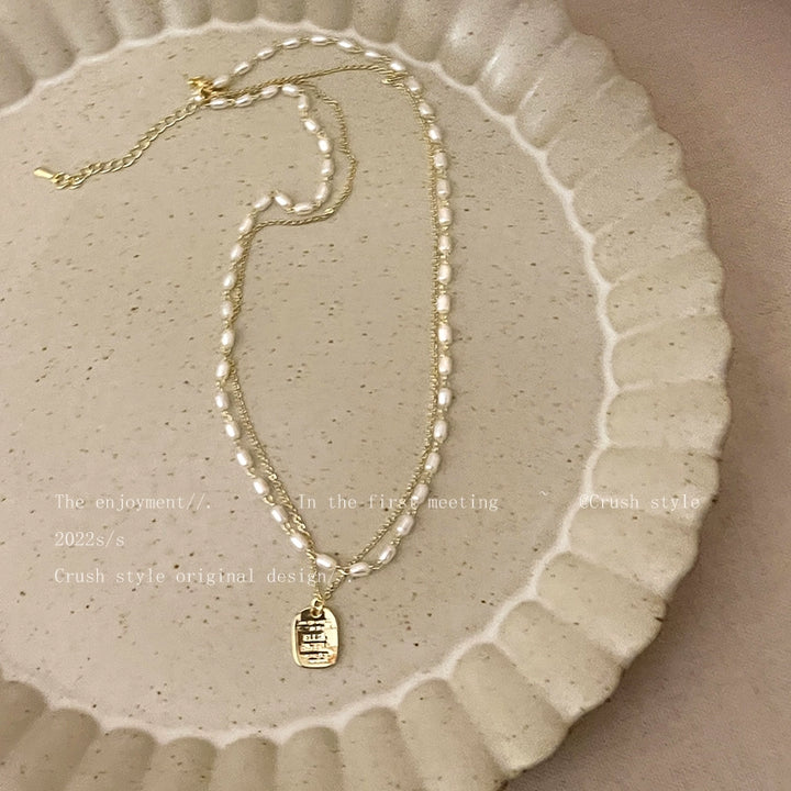 Gold pearl necklace women's spring sense of luxury, light luxury, niche necklace accessories, double layered personality clavicle chain