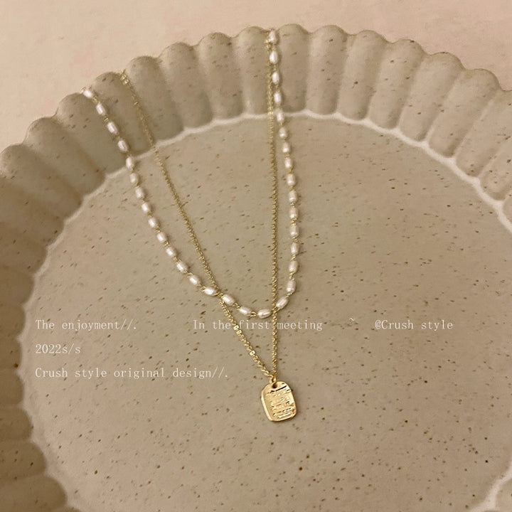 Gold pearl necklace women's spring sense of luxury, light luxury, niche necklace accessories, double layered personality clavicle chain